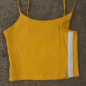 Yellow crop top with white stripes down both sides spaghetti straps